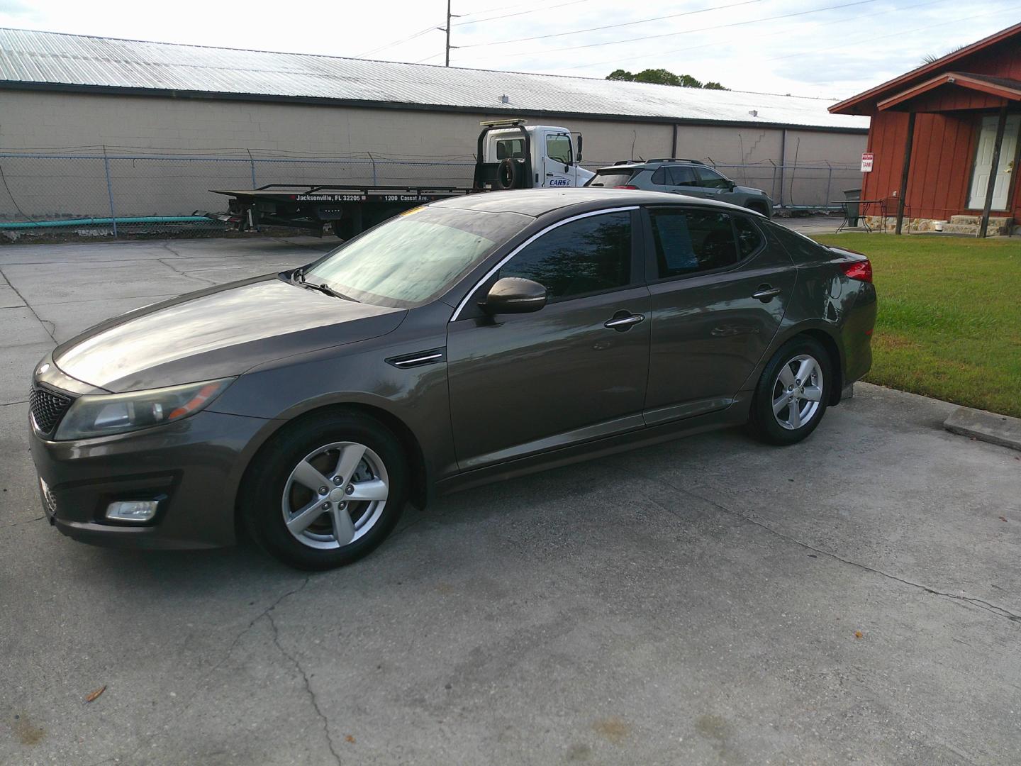 2015 BRONZE KIA OPTIMA LX (5XXGM4A71FG) , located at 1200 Cassat Avenue, Jacksonville, FL, 32205, (904) 695-1885, 30.302404, -81.731033 - Photo#1